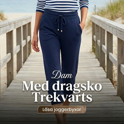 Joggingbyxor med hög midja och smal passform, dragsko och fickor