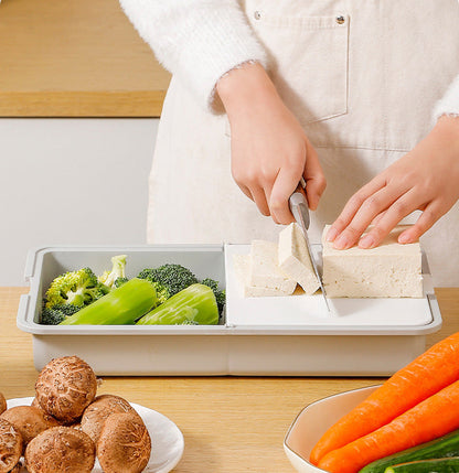 Multifunktionell skärbräda med rivjärn och dränering