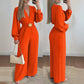 Elegant jumpsuit med V-ringning, vida ben och bälte