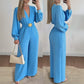 Elegant jumpsuit med V-ringning, vida ben och bälte