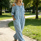👗👖 Cold-shoulder jumpsuit med vida ben och fickor