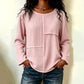 Damtopp med rundhals och texturerad patchwork