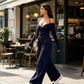 Elegant djup V-ringad jumpsuit med halterneck för kvinnor