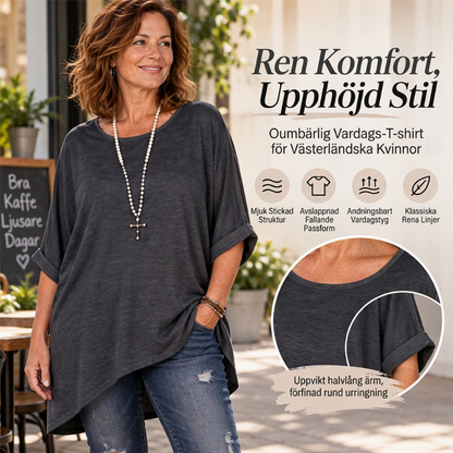 Lös kvinnlig topp med batwingärmar och asymmetrisk design